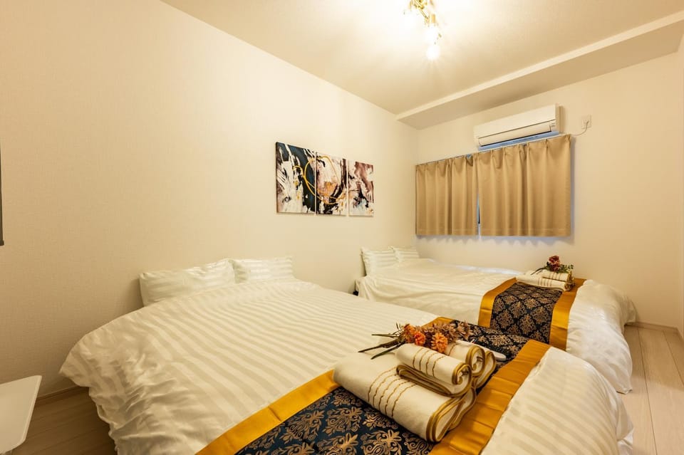 Bed, Photo of the whole room, Bedroom, towels, air conditioner