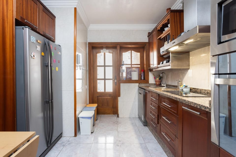 Kitchen or kitchenette, dishwasher, microwave, oven, stove