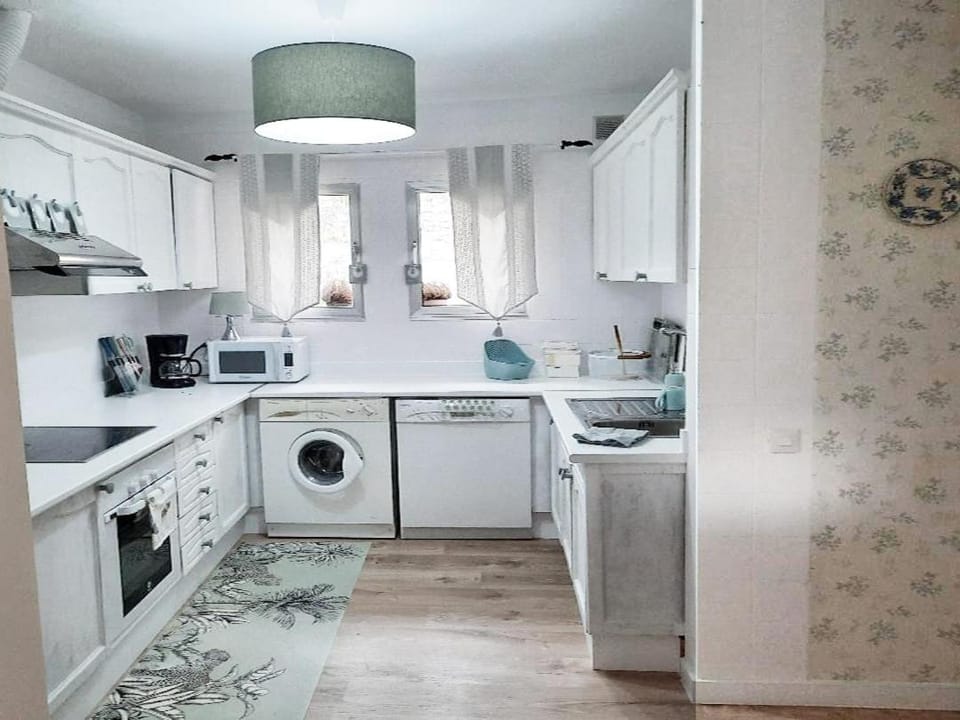 Kitchen or kitchenette, dishwasher, oven, stove, washing machine, dryer