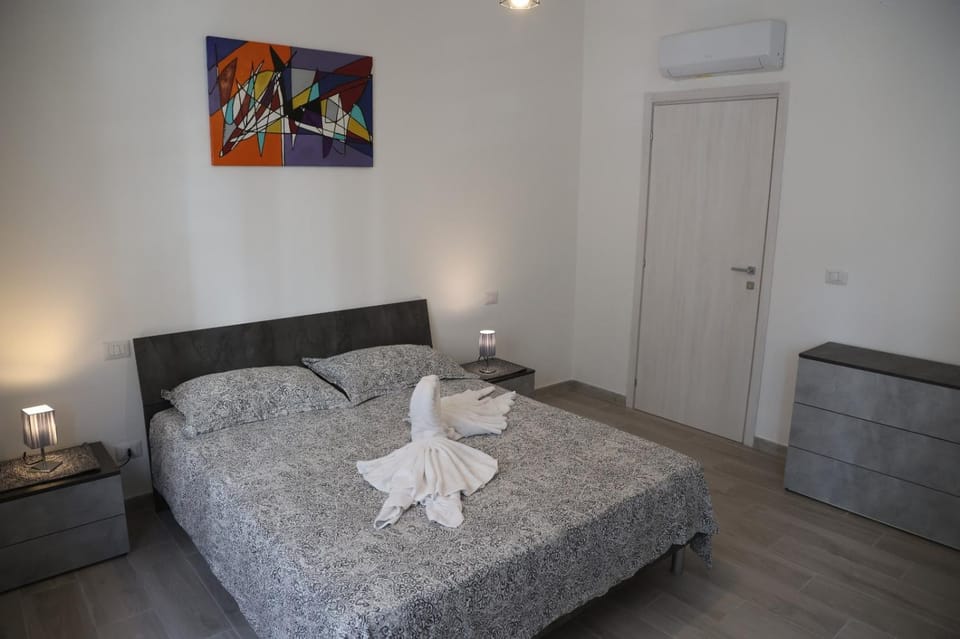 Photo of the whole room, Bedroom, towels, air conditioner