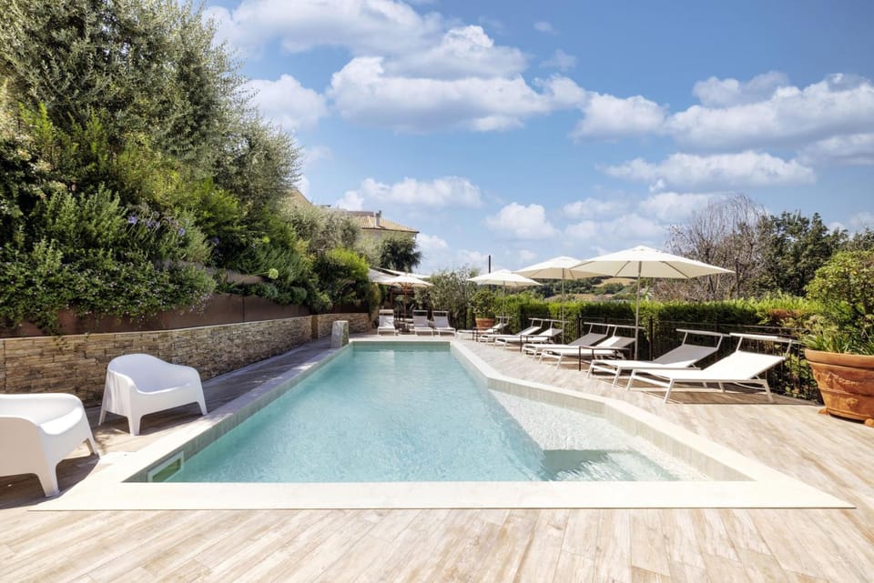 Property building, Spring, Natural landscape, Solarium, Pool view, Swimming pool, Swimming pool, Swimming pool, sunbed