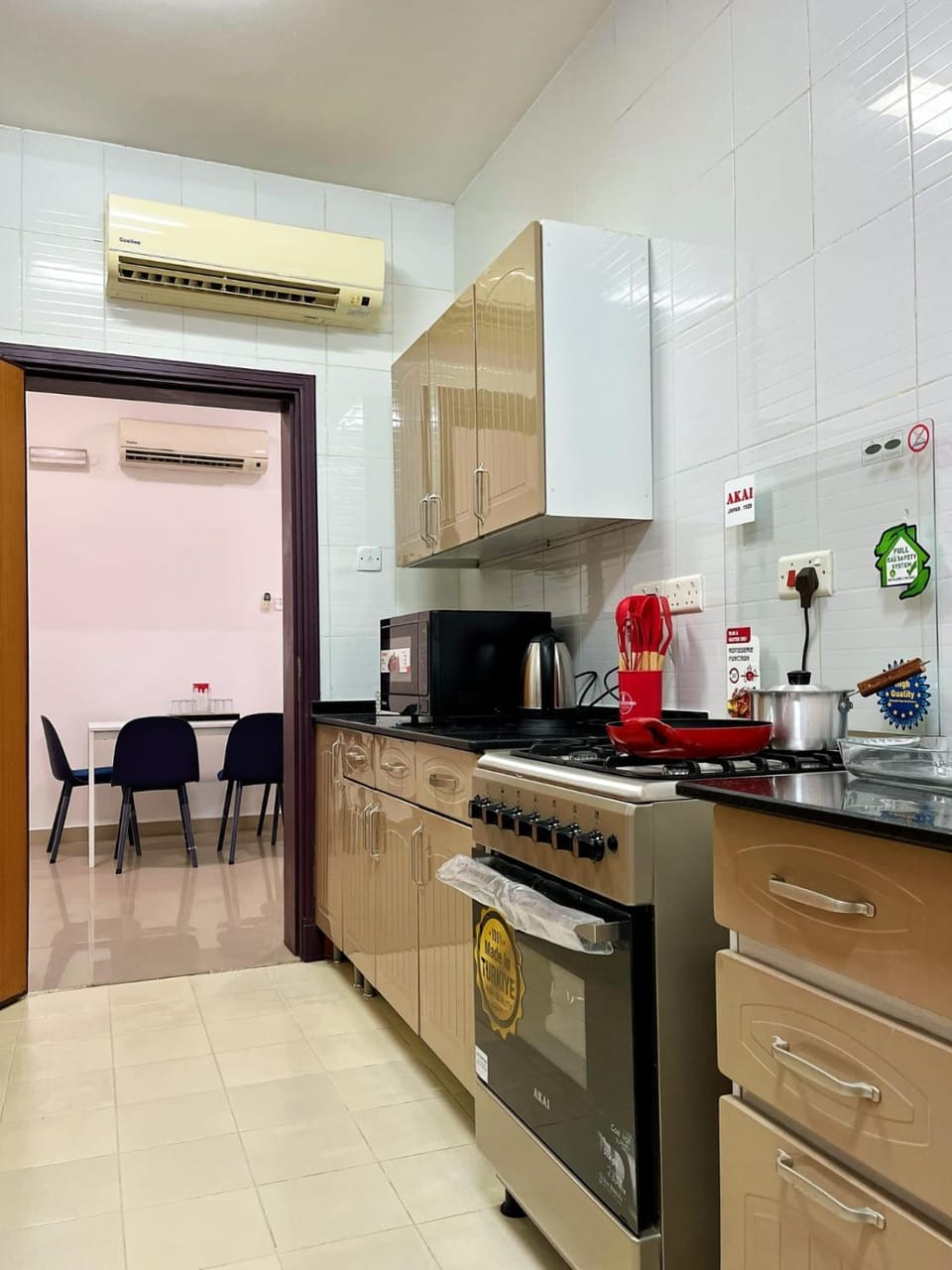 Kitchen or kitchenette, oven, stove, toaster, air conditioner