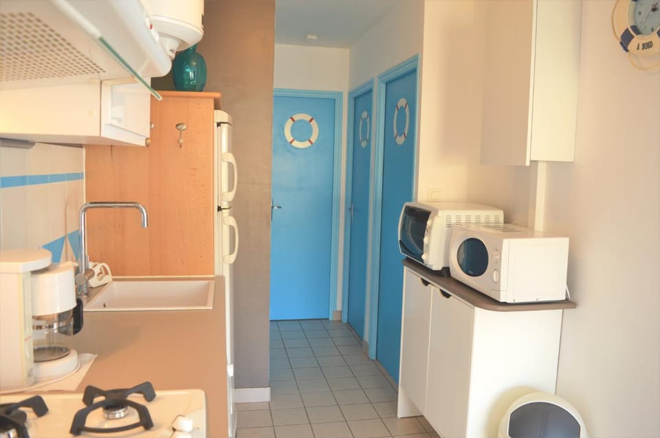 Kitchen or kitchenette, oven, stove, toaster