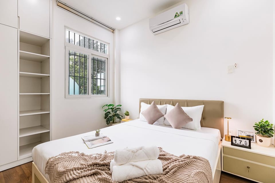 Bed, Photo of the whole room, Decorative detail, Bedroom, towels, wardrobe, air conditioner
