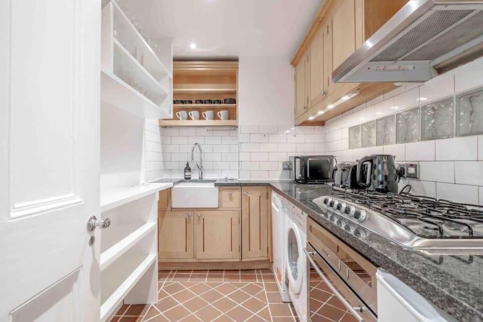 Kitchen or kitchenette, dishwasher, stove, washing machine, dryer