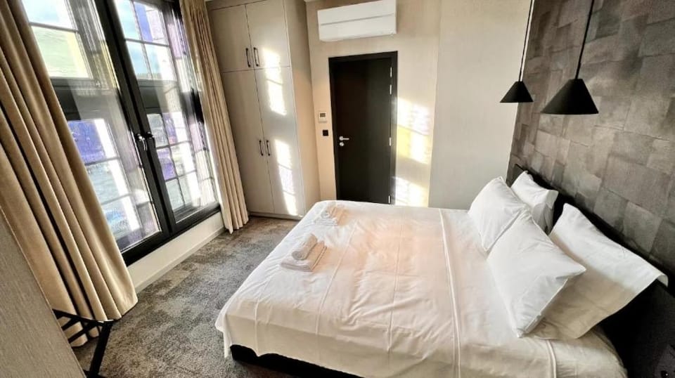 Bed, Photo of the whole room, Bedroom, towels, air conditioner