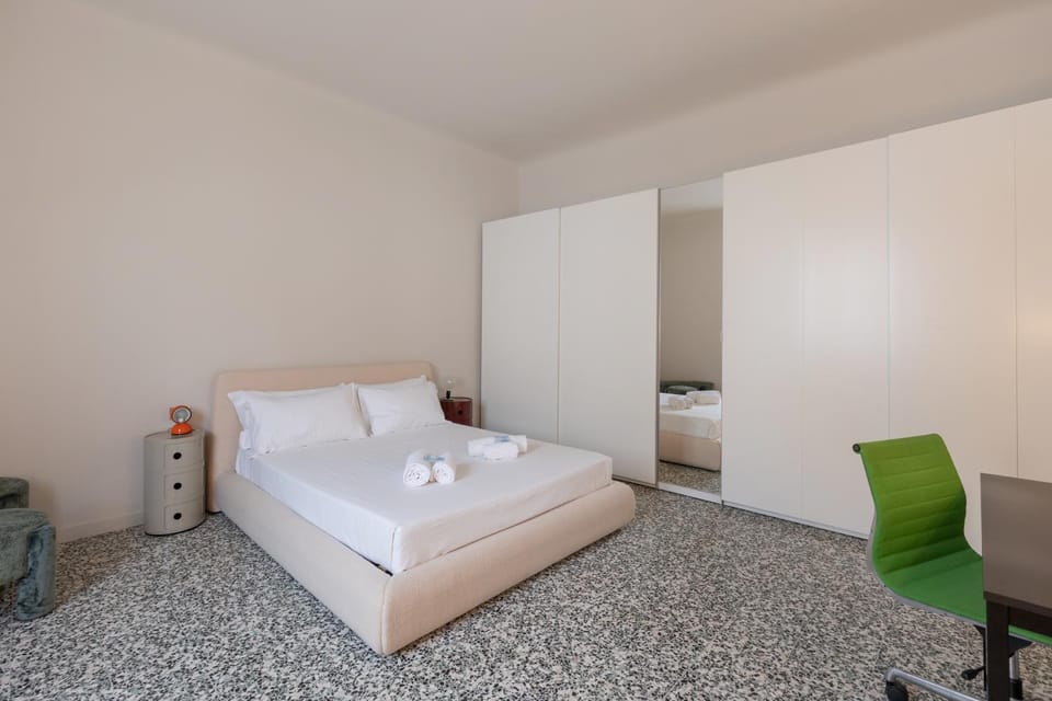 Bed, towels, wardrobe