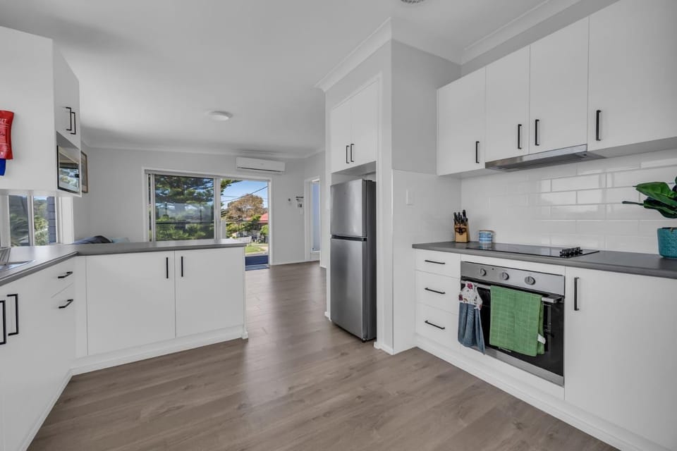 Kitchen or kitchenette, oven, stove, air conditioner