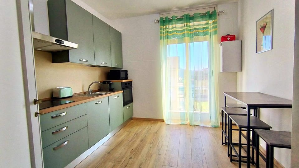 Kitchen or kitchenette, microwave, oven, stove, toaster, kitchen
