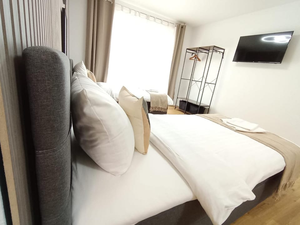 Communal lounge/ TV room, Bed, Living room, Seating area, Bedroom