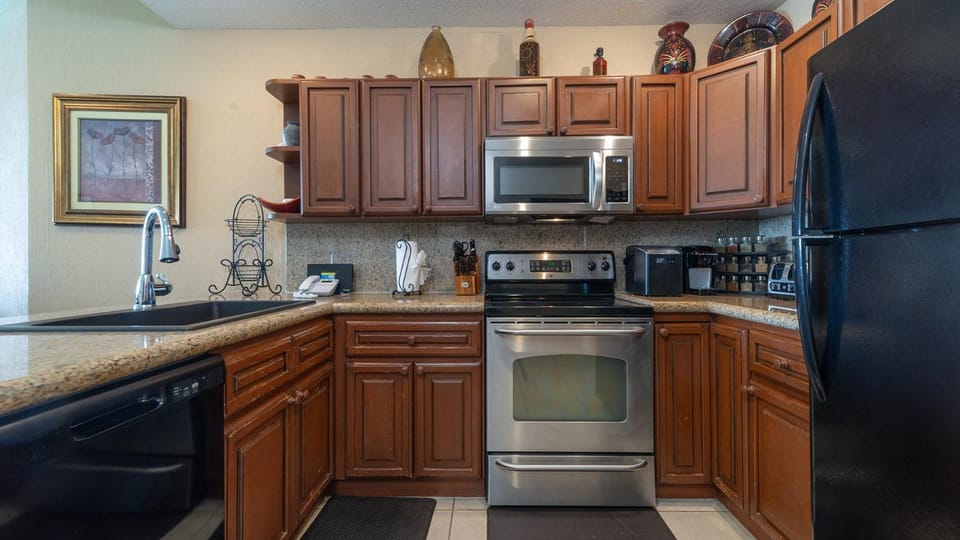 Kitchen or kitchenette, dishwasher, oven, stove, toaster
