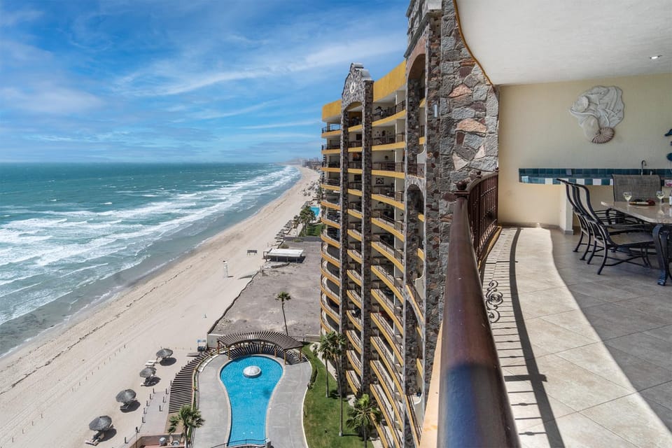 Property building, View (from property/room), Balcony/Terrace, Seating area, Dining area, Beach, Pool view, Sea view, Swimming pool