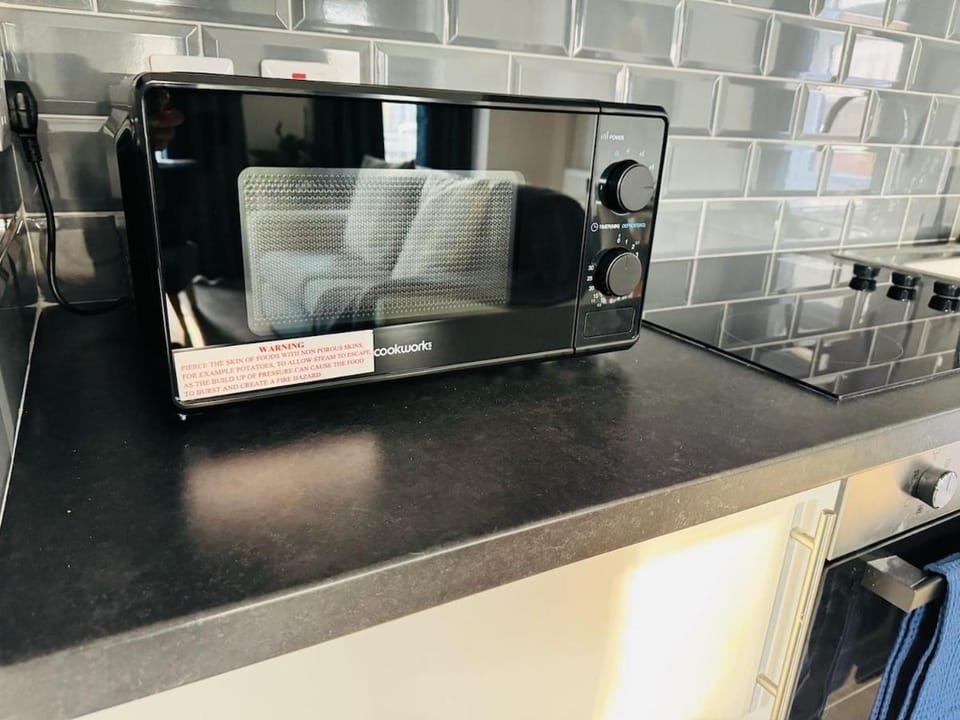Kitchen or kitchenette, microwave