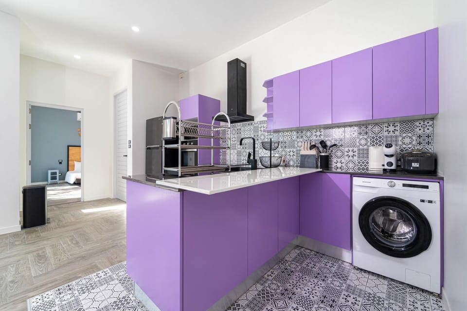 Kitchen or kitchenette, stove, toaster, washing machine