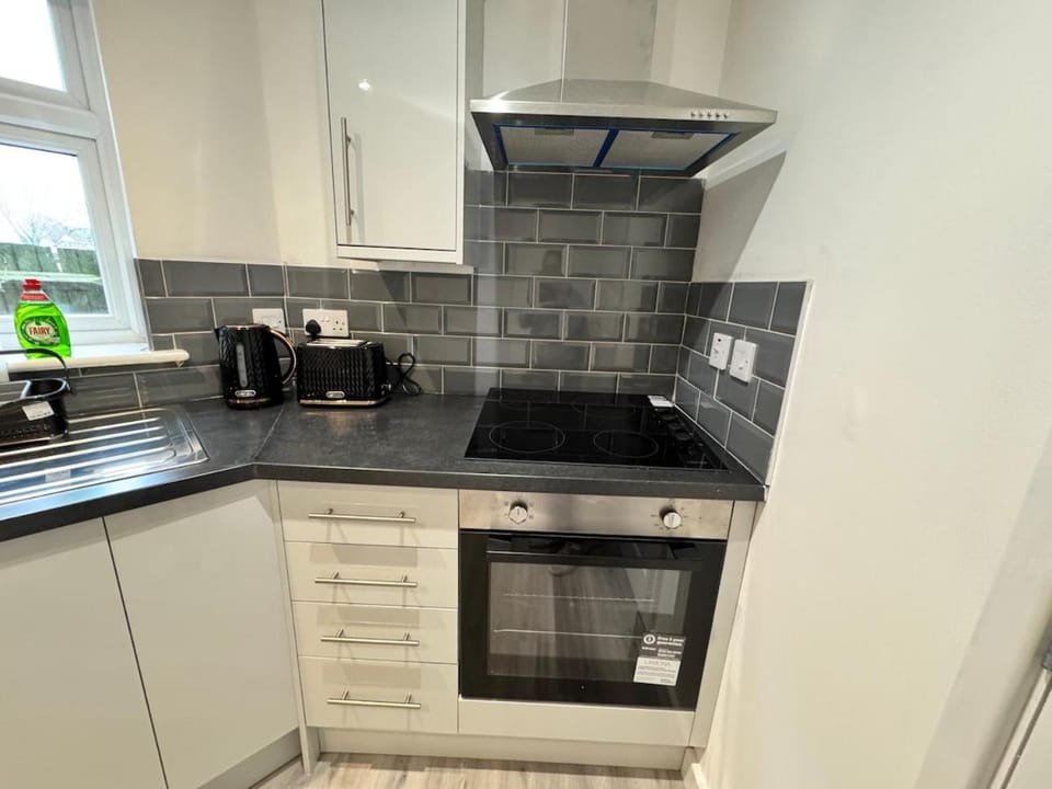 Kitchen or kitchenette, stove, toaster