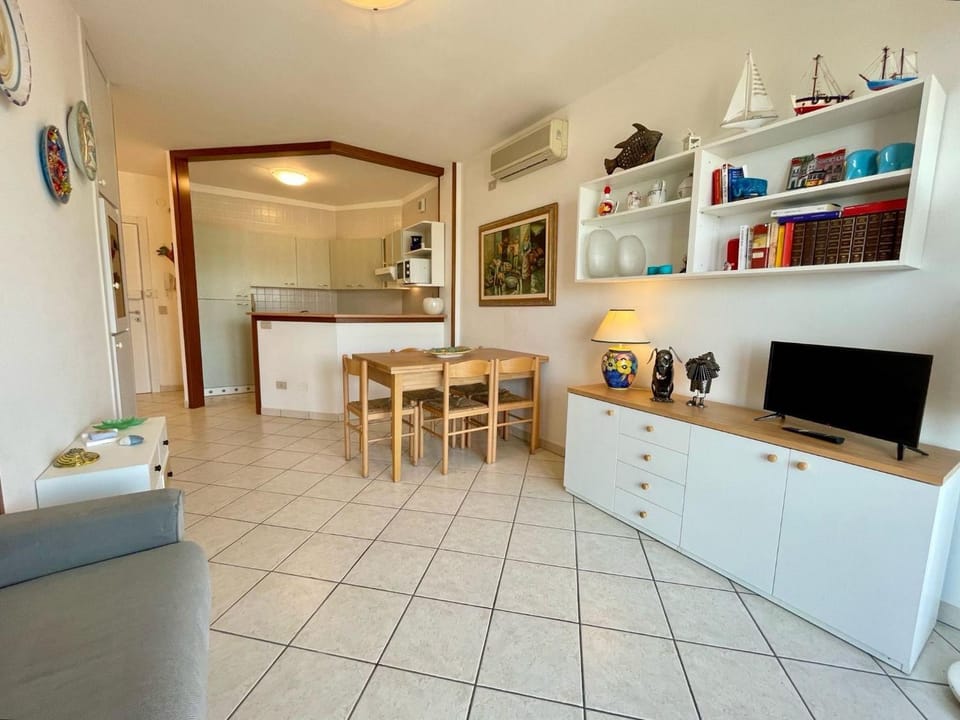 Bright apartment with shared pool Apartment in Porto Santa Margherita