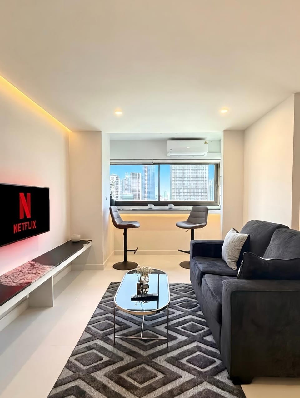 TV and multimedia, Living room, Seating area, City view, air conditioner