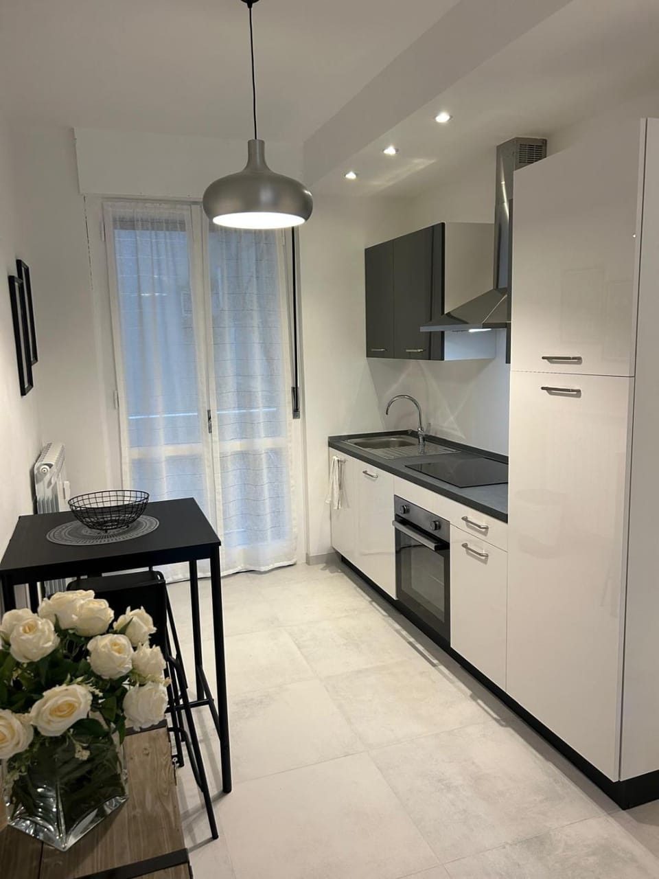 Kitchen or kitchenette, dishwasher, oven, stove