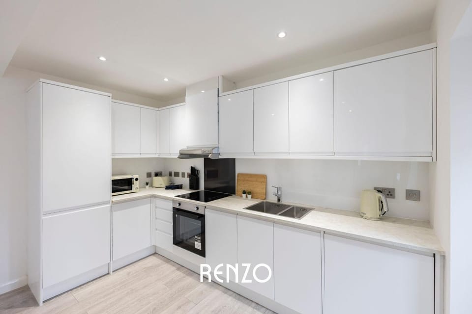 Kitchen or kitchenette, dishwasher, oven, stove, toaster