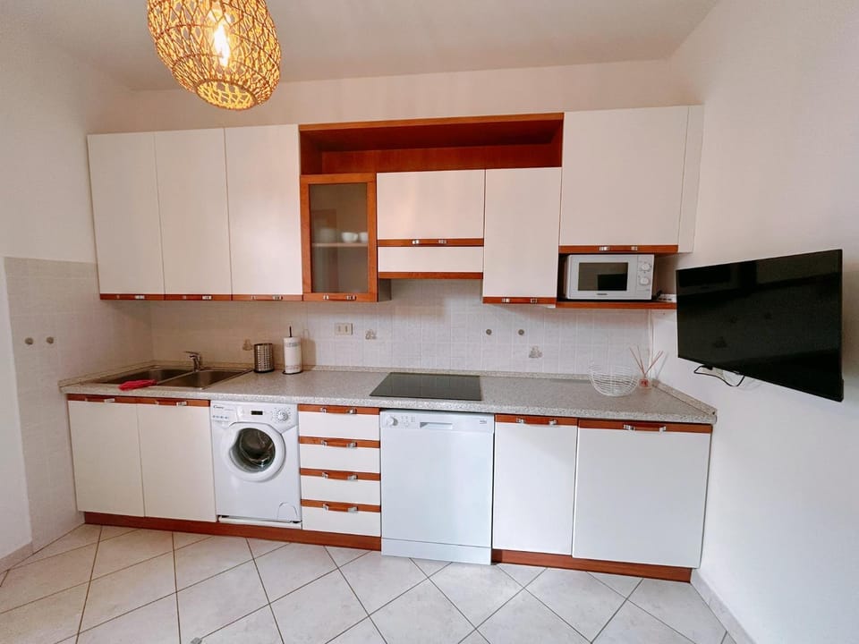 Kitchen or kitchenette, dishwasher, oven, stove, washing machine
