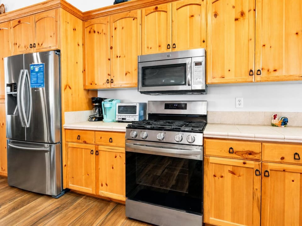 Kitchen or kitchenette, dishwasher, oven, stove, toaster