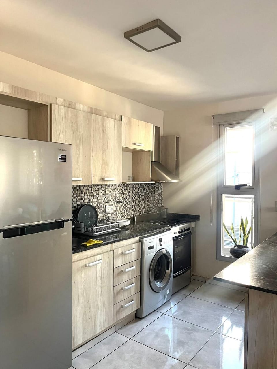 Kitchen or kitchenette, oven, stove, washing machine