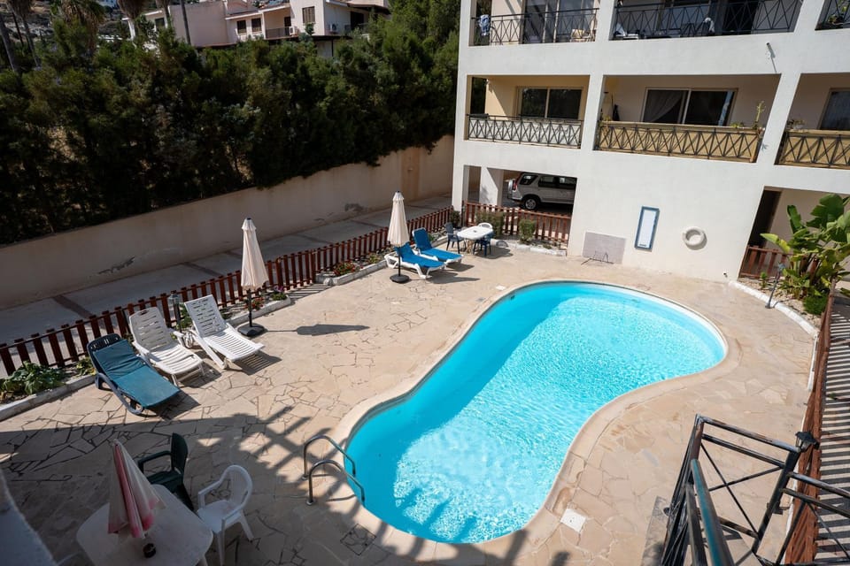 Property building, Patio, Communal lounge/ TV room, Day, View (from property/room), Balcony/Terrace, Pool view, Swimming pool, sunbed