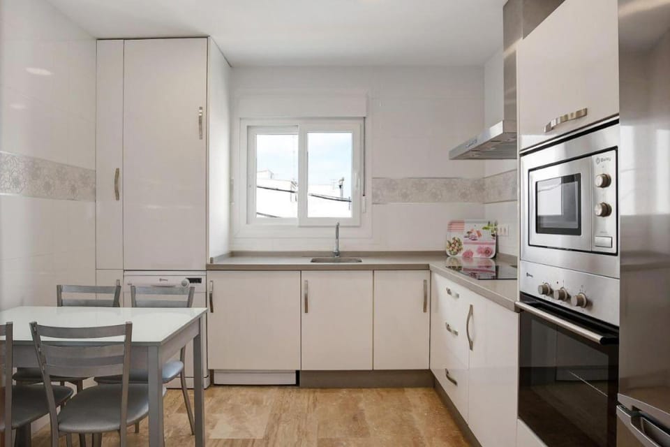 Kitchen or kitchenette, dishwasher, stove, toaster