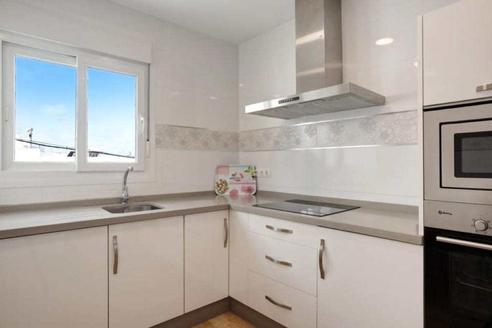 Kitchen or kitchenette, dishwasher, oven, stove