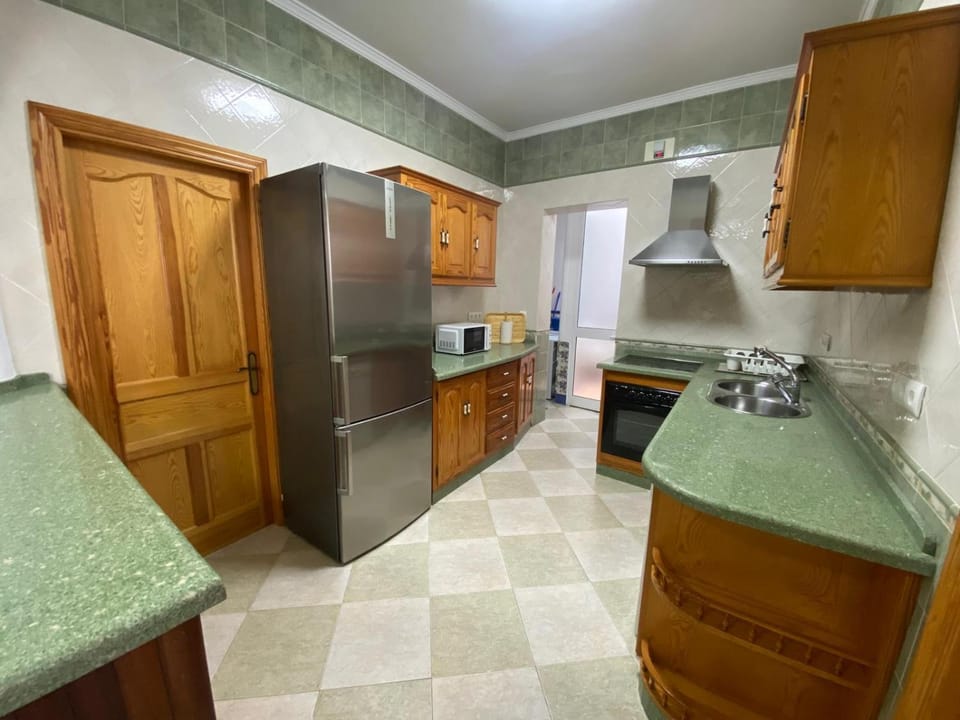 Kitchen or kitchenette, dishwasher, oven, stove