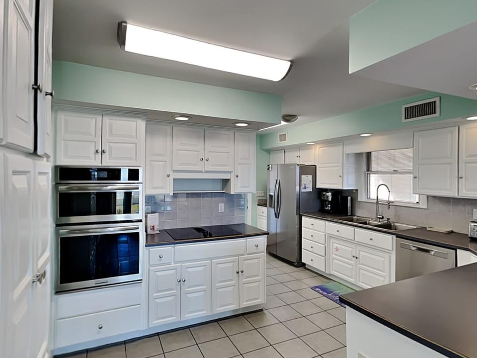 Kitchen or kitchenette, oven, stove, air conditioner