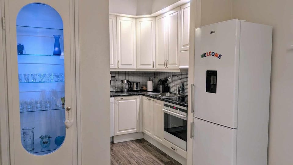 Kitchen or kitchenette, dishwasher, oven, stove