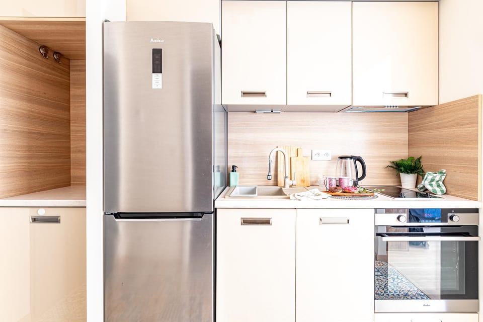 Kitchen or kitchenette, dishwasher, oven, stove