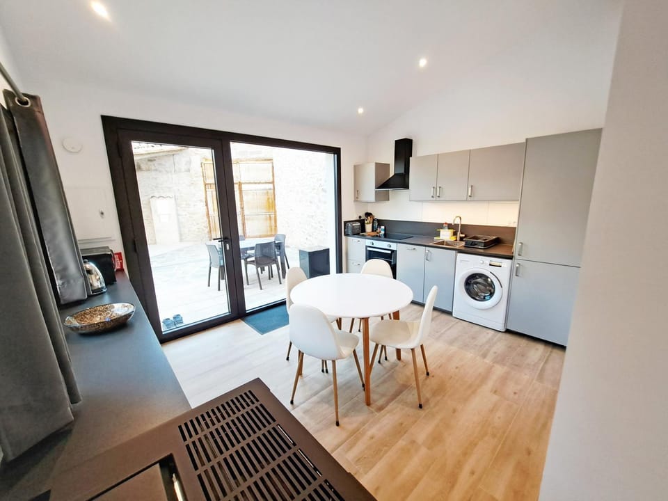 Seating area, Dining area, oven, stove, washing machine, kitchen