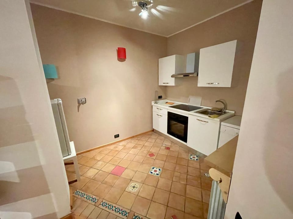 Kitchen or kitchenette, dishwasher, oven, stove