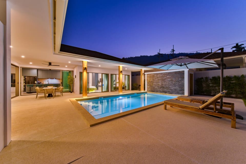 Property building, Patio, Night, Natural landscape, Pool view, Swimming pool, Swimming pool, sunbed