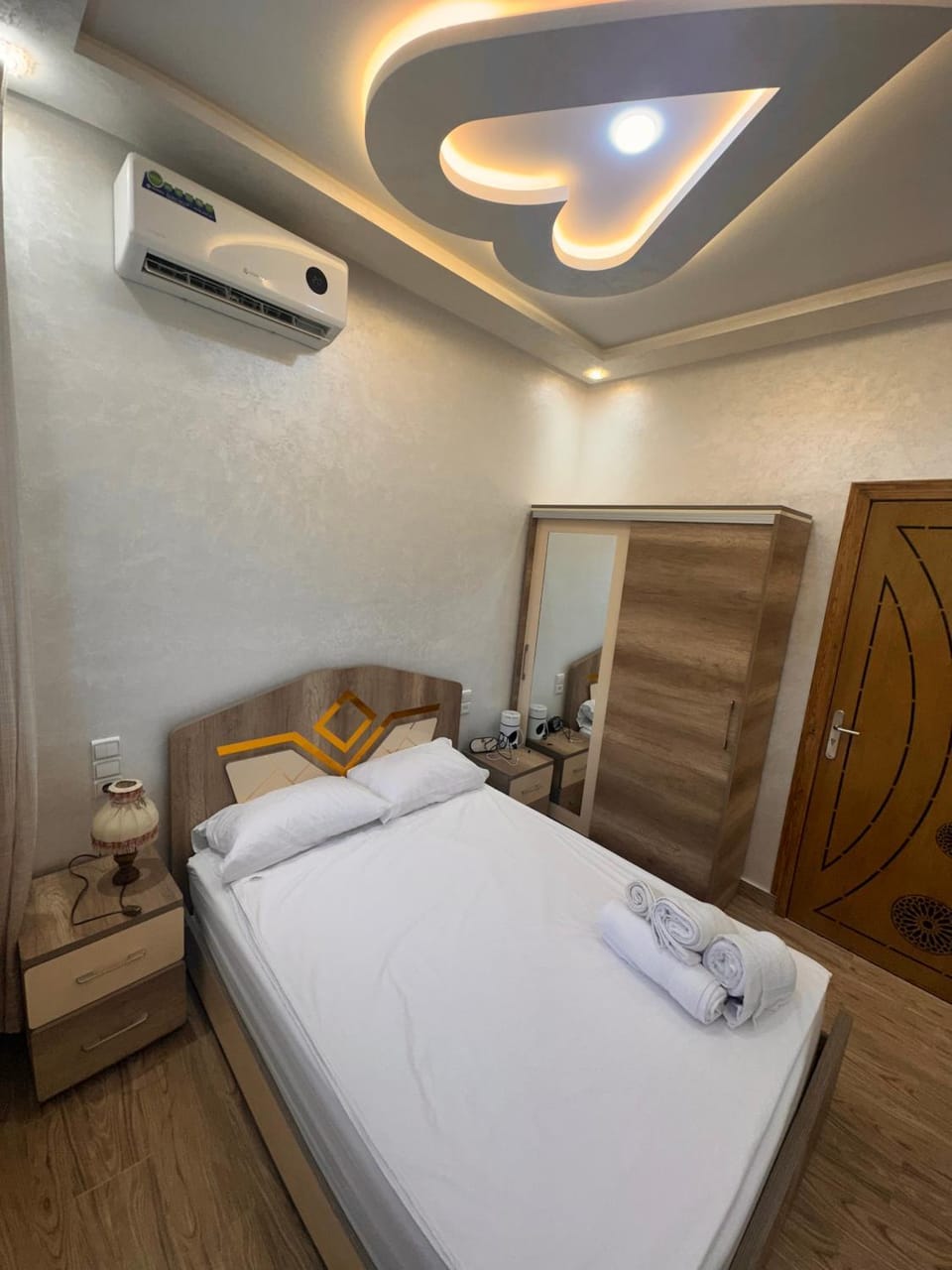 Bed, Photo of the whole room, Bedroom, towels, air conditioner