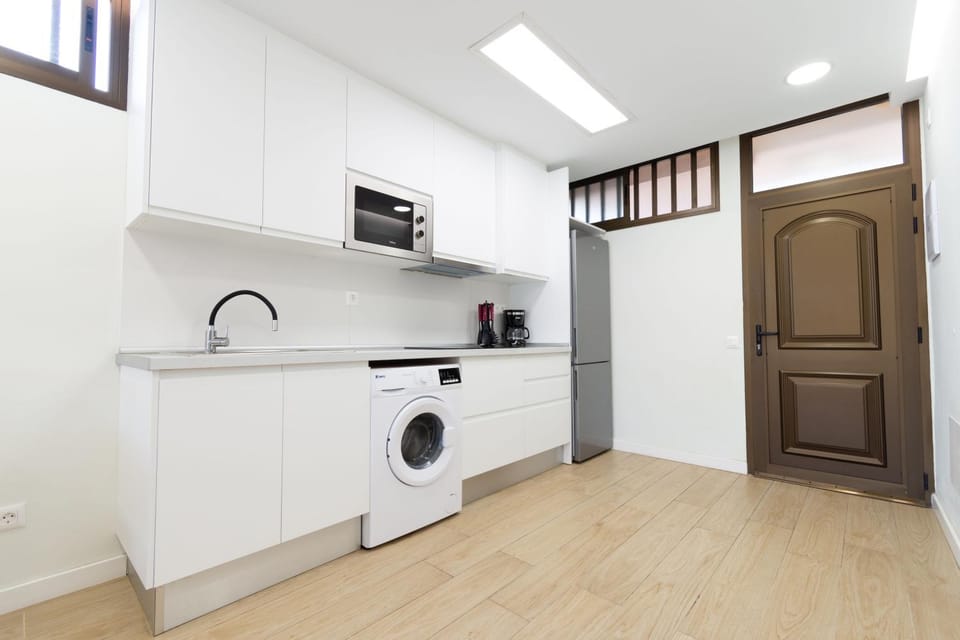 Kitchen or kitchenette, stove, washing machine