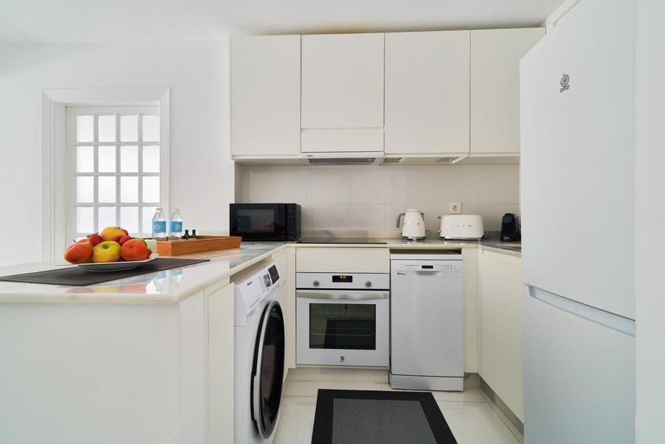 Kitchen or kitchenette, dishwasher, oven, stove, toaster