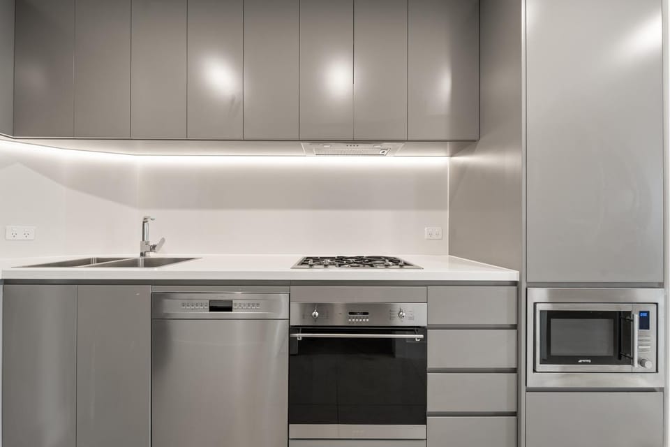 Kitchen or kitchenette, dishwasher, microwave, oven, stove