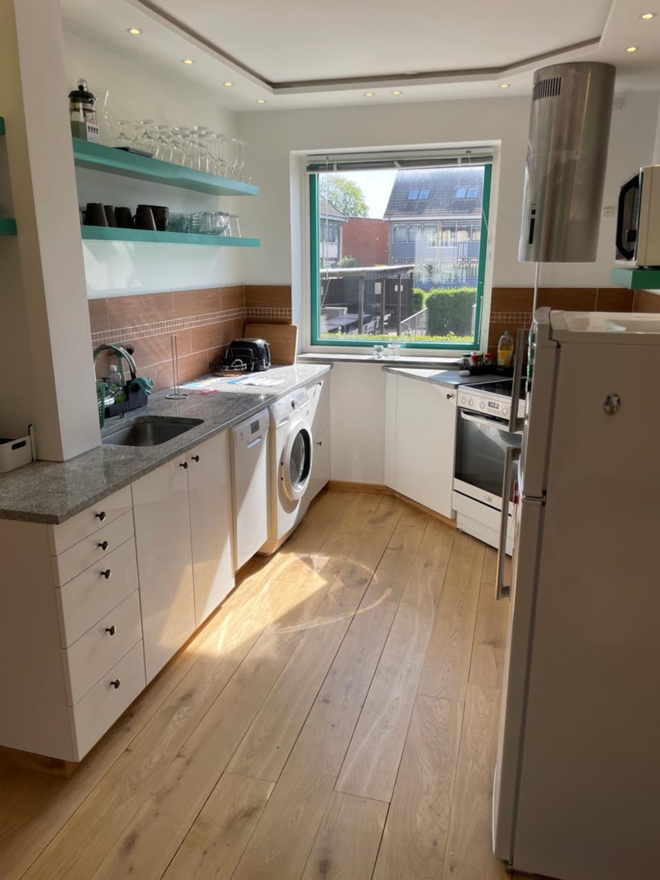 Kitchen or kitchenette, dishwasher, stove, toaster, washing machine