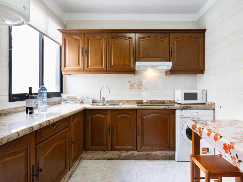 Kitchen or kitchenette, Dining area, stove, washing machine