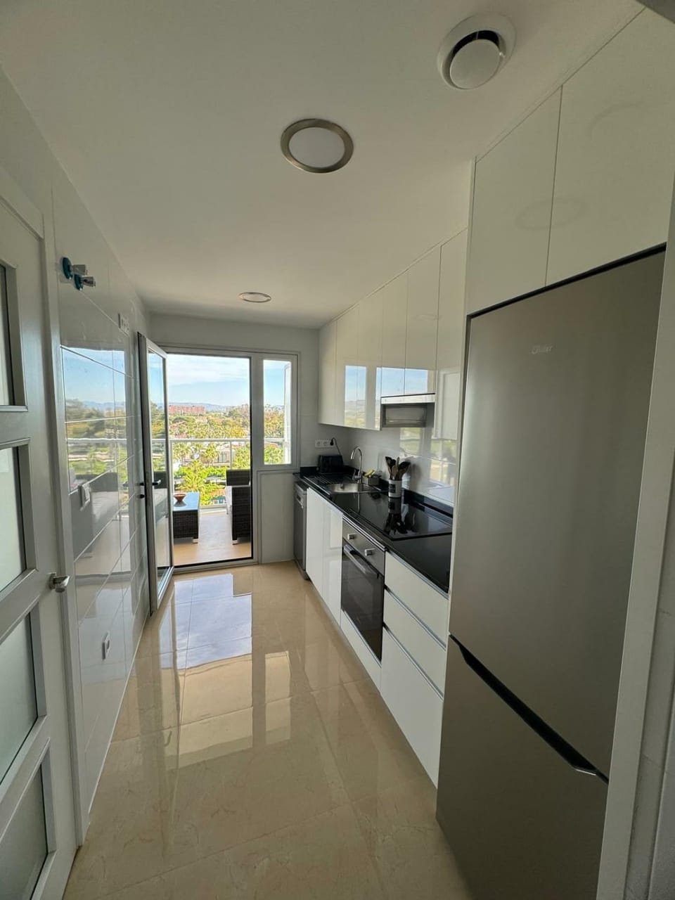Kitchen or kitchenette, dishwasher, oven, stove