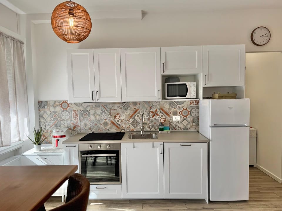 Kitchen or kitchenette, dishwasher, oven, stove, toaster
