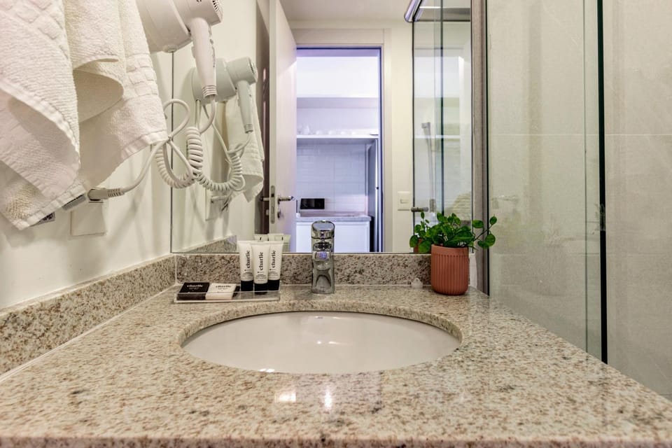 Shower, Bathroom, hair dryier, towels