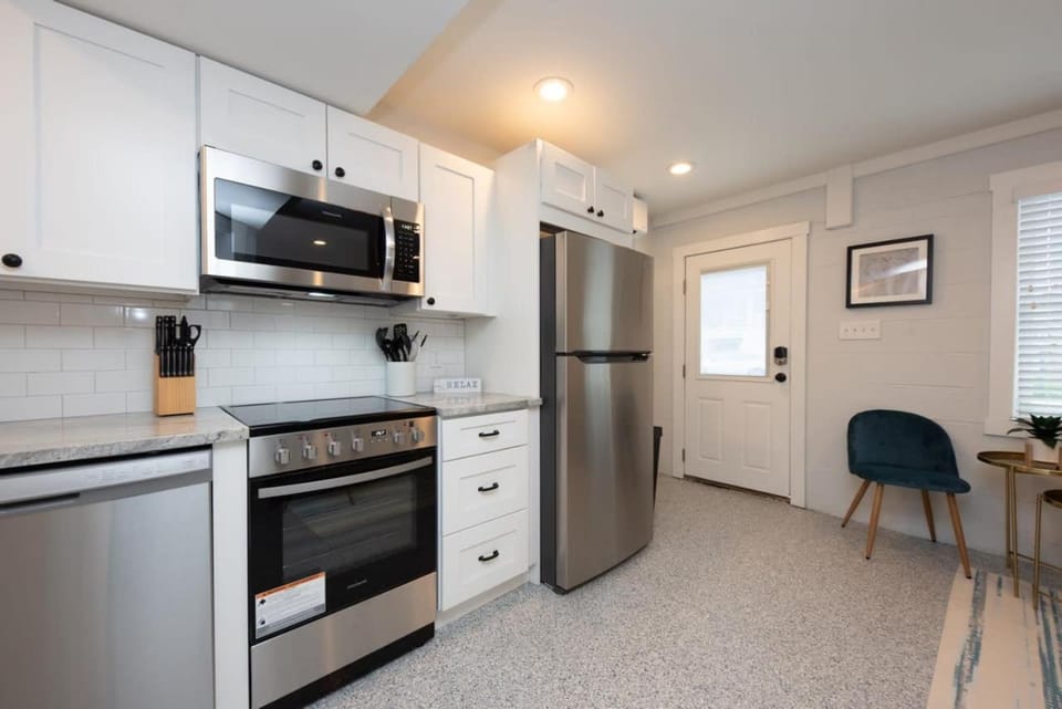Kitchen or kitchenette, dishwasher, oven, stove