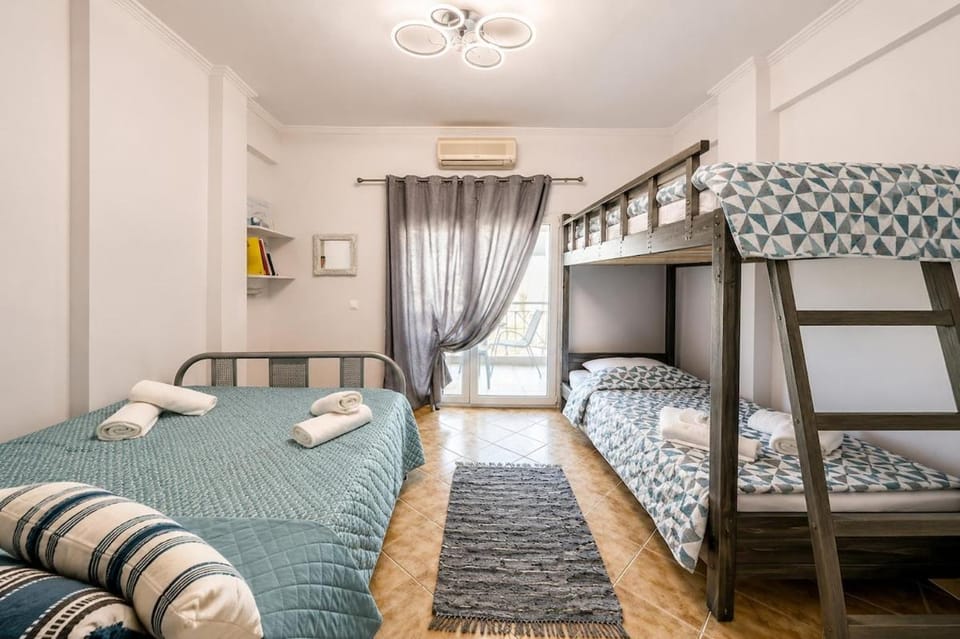 Bed, Photo of the whole room, Bedroom, bunk bed, towels, air conditioner