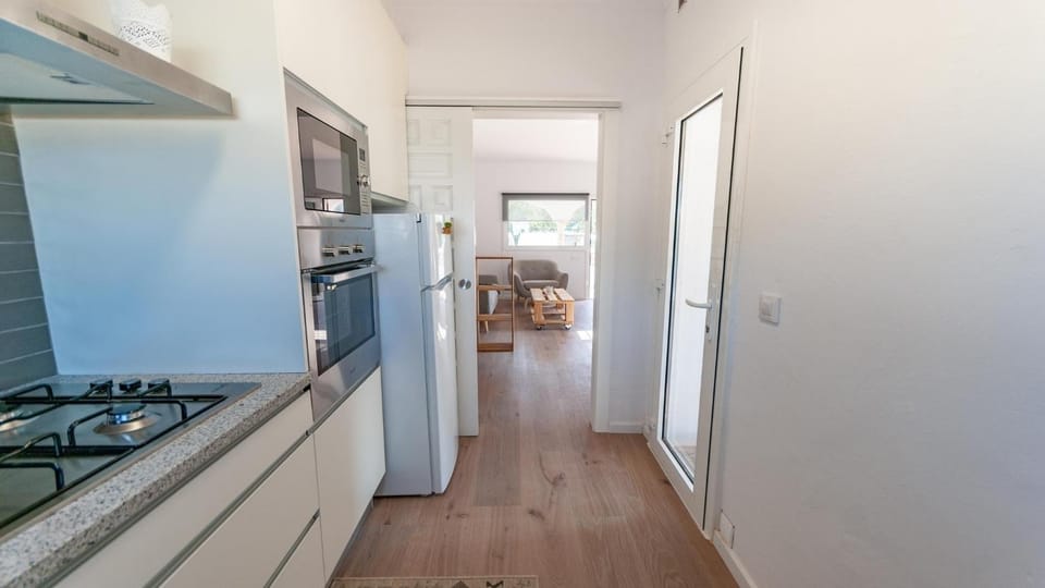 Kitchen or kitchenette, dishwasher, oven, stove