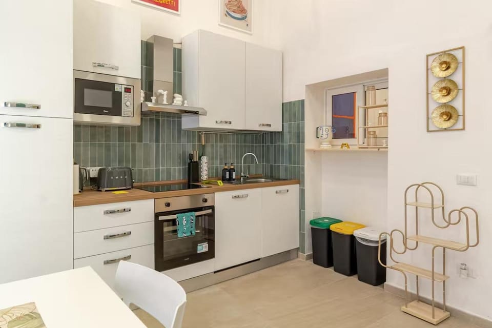 Kitchen or kitchenette, dishwasher, oven, stove, toaster