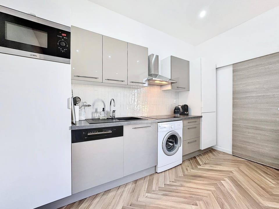 Kitchen or kitchenette, dishwasher, stove, toaster, washing machine